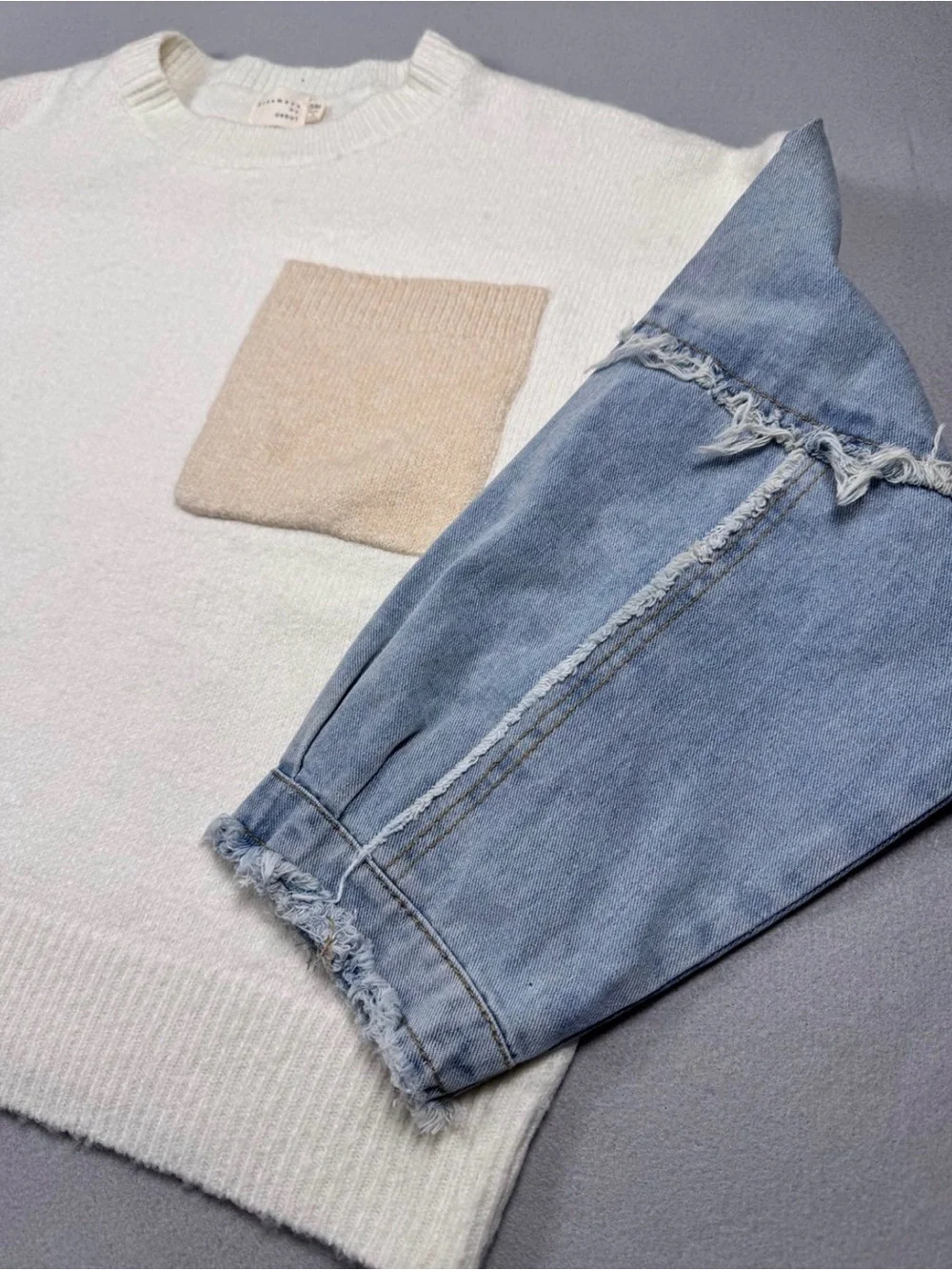 Dreamers Cream Knit Crewneck Sweater with jeans sleeves and Beige Pocket Accent